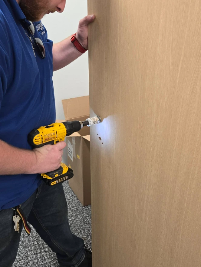 Zento Lock & Key locksmith installing residential door lock in Aiken SC