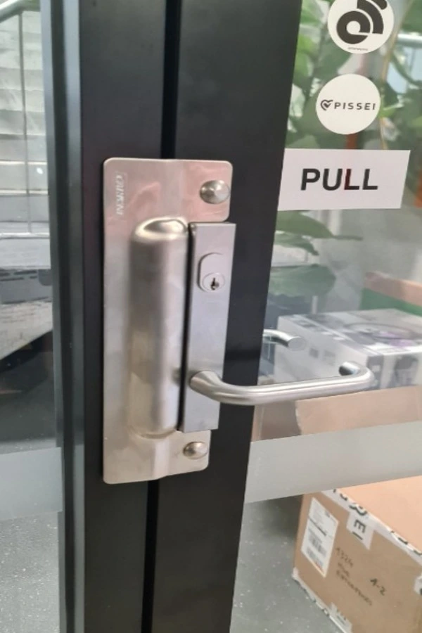 Commercial door lock hardware at Aiken SC 
office building showing security access point