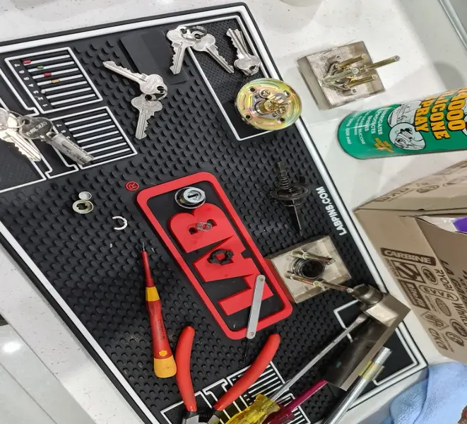 Professional locksmith tools organized on service board used for residential lock work in Aiken SC